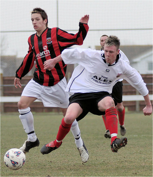 Pat Dunning is tackled by Mark Livermore
