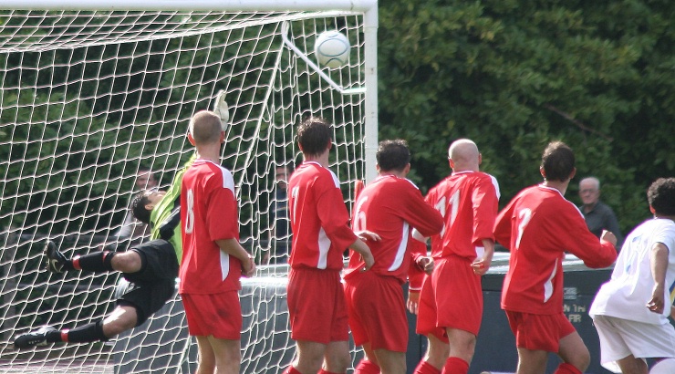 Nick Gindre, having been booked for a foul on Scott Fitzgerald, makes a great save from the free kick
