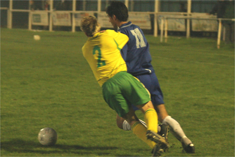 Paul Henty (2) tussles with Shaheen Sadough (11)
