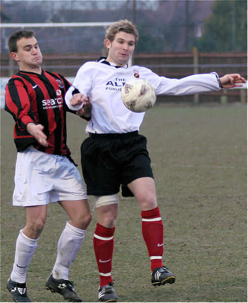 Jordan Willis brings the ball under control closely shadowed by Ben King
