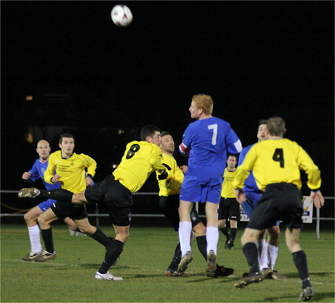 Rob Norris (7) gets this header on target
