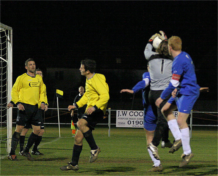 Littlehampton keeper Anthony Di'Bernado grabs the ball challenged by Rob Norris
