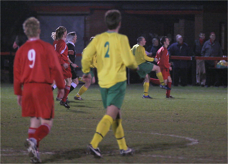 Richard Davies drives the ball home from about 25 yards to open the scoring for Sidlesham ...
