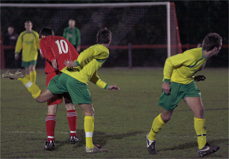 Crawley Down's Nick Sullivan (10) turns away while Sidlesham players (Danny Jones and Paul Grantham ?) try something different
