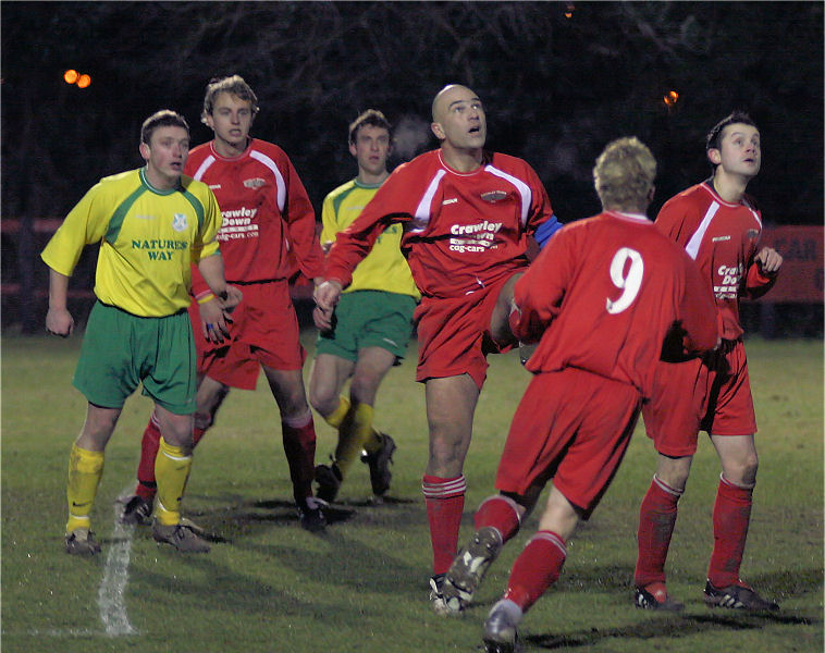 Paul Otway, Crawley Down captain, hooks the ball clear
