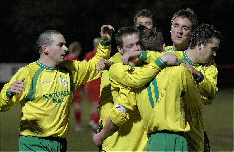 Charlie Hammond (centre) has just squeezed in Sidlesham's second
