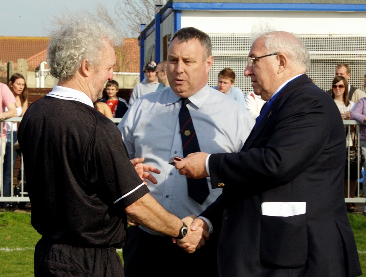 Referee Paul John receives his memento from Peter Bentley
