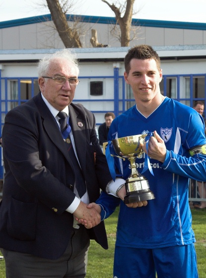 Carl Dunk receives the SCFL Division 3 Challenge Cup from Peter Bentley
