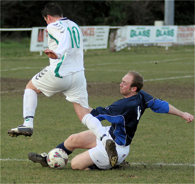 Callum Cutler is tackled by Phil Rhodes
