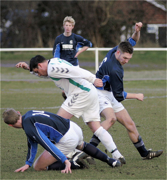 Callum Cutler tries to get between Drew Crush and Danny Baker
