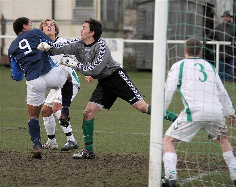 Gary Smart punches away from Wes Tate
