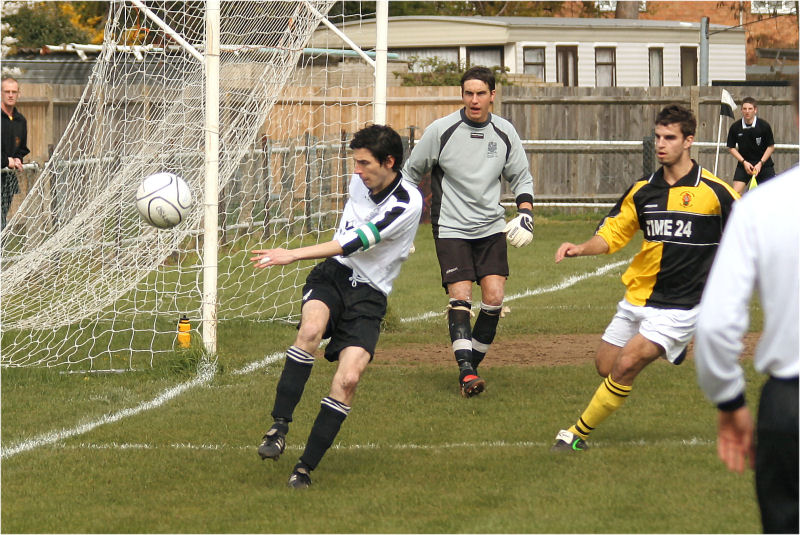 Molesey captain Paul Gower clears
