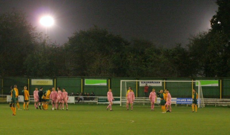Horsham line up a free kick watched by two alien starships, I think
