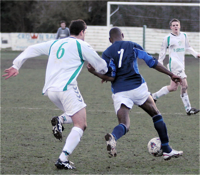 Jamie Angell (6) about to tackle Wayne Clarke (7)

