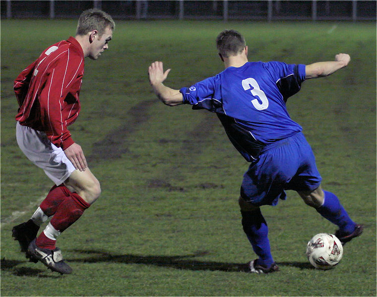 Dave McCarthy on the ball watched by Lee Barnard
