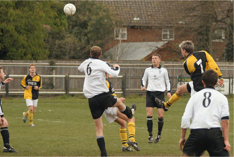 Steve Harper (7) gets a shot in as Danny Thomas (6) jumps to head the ball with Sam Lampard (8) looking on
