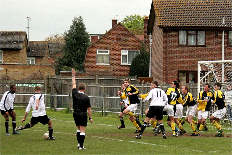 Burgess Hill pack the defence for this free kick taken by Russell Pym (7) inside the area ...
