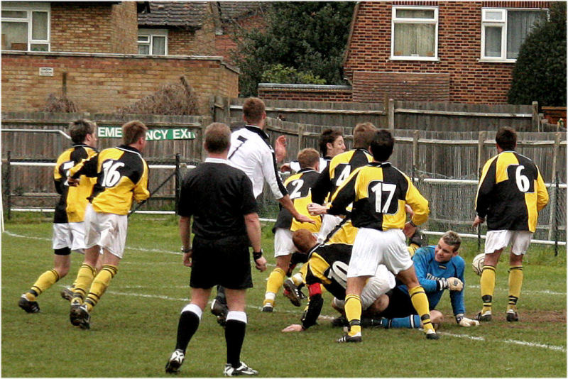 ... but Chris Wales (at the back between 2 & 4) pokes the ball home for Molesey's third on 90 minutes
