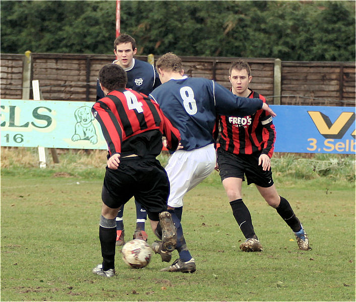 Simon Clayton goes between Chris Morrow and Danny Curd
