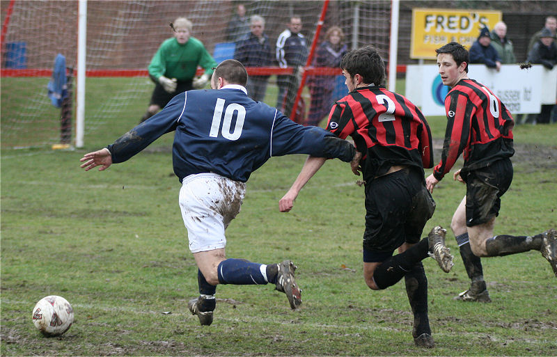 Matt Huckett's (10) run on goal is covered by Mark Dixon (2) and Dave Sharman (6) ...
