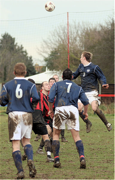 Mike Huckett climbs highest for this header
