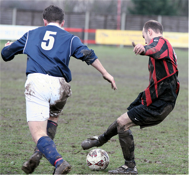 Darren Annis pulls the ball back avoiding Stuart Hack (5)
