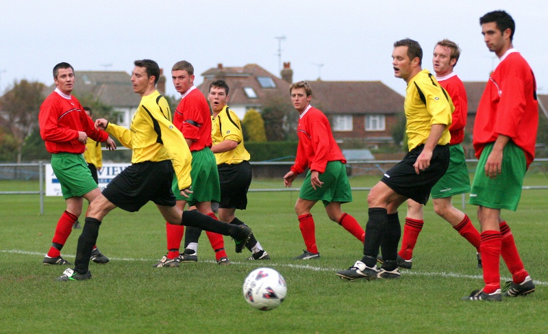 Nobody reaches this ball across the goal mouth
