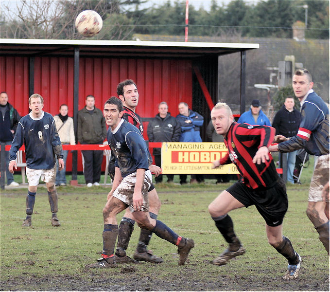 Simon Clayton, Jason Wimbleton and Pete Christodoulou watch as Kane Evans and Jim Smith try and reach the ball
