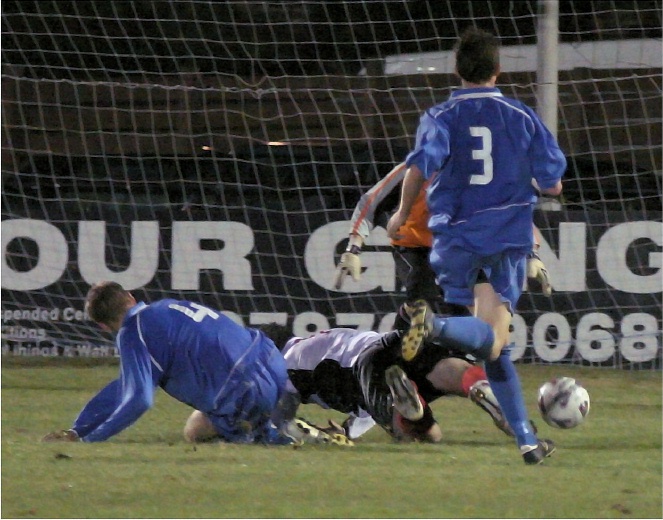 Rob Wimble is tackled by Matt Hurley
