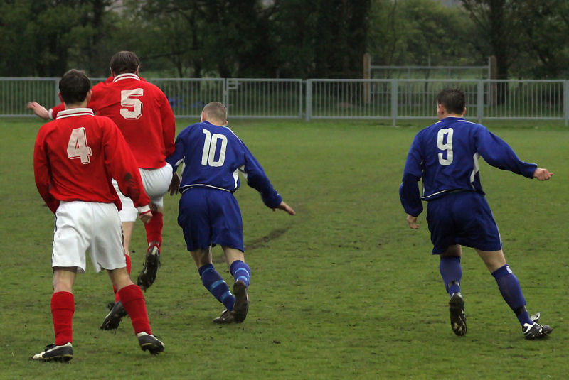 Paul Sumnall (4), Nick Edgington (5) and James Highton (10) compete for the ball with Craig Cox (9) nearby
