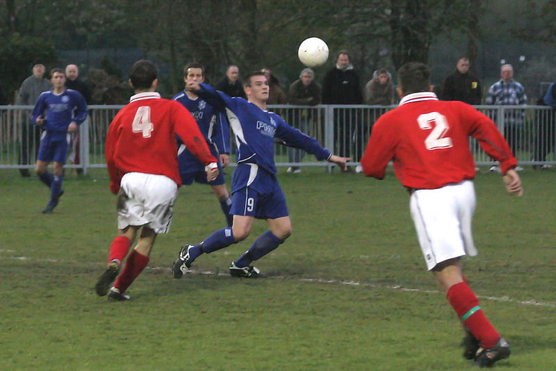 Craig Cox (9) brings the ball under control with Paul Sumnall (4) and Allan Clarke (2) closing in
