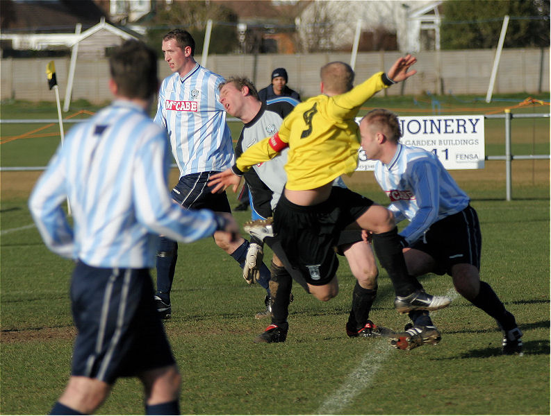 Steve Davies nicks the ball away from several defenders to put Littlehampton ahead
