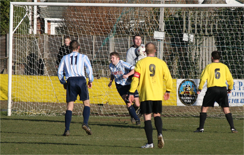 Wes Hallett grabs the ball under pressure
