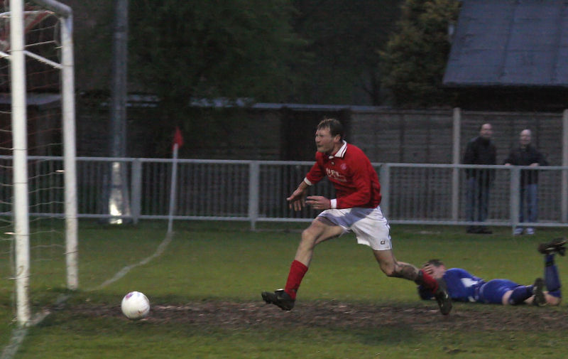 Craig Cox worked hard to win the ball in spite of taking a heavy knock watches his effort open the scoring for Rustington...
