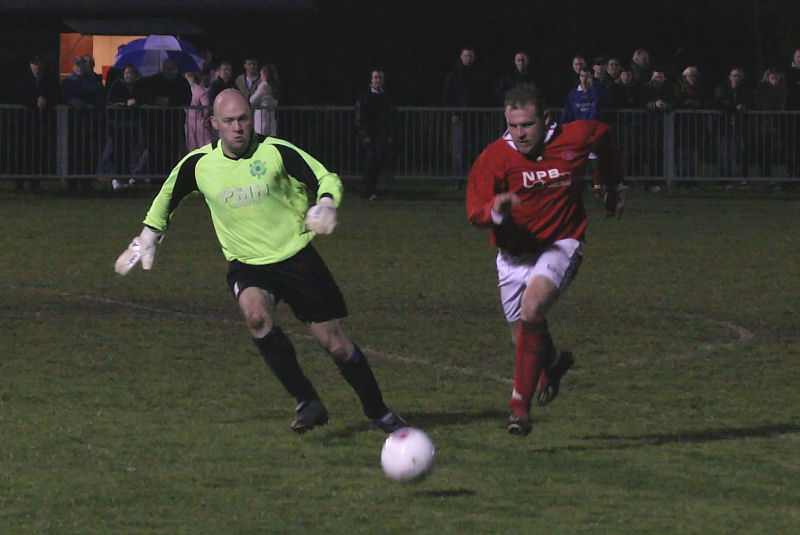 Rustington keeper Matt Grieves deals with this Bosham attack
