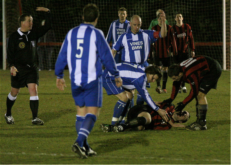 Players from both sides are concerned as Mike Duffell goes down with a nasty leg injury in the first minute of the second half. 
