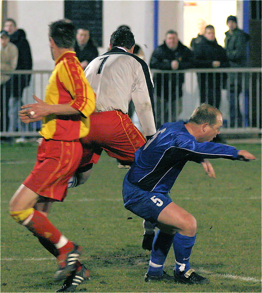 Keeper Danny Breach is challenged by Richie Hellen
