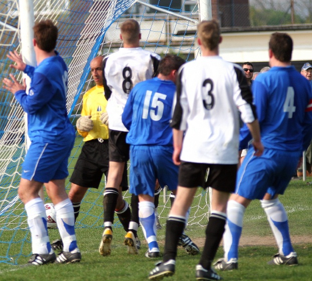 Dave Oakes (hidden) finds the net
