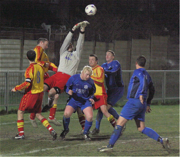 Danny Breach reaches this ball challenged by Russ Tomlinson
