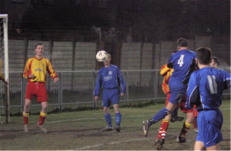 Brett Neal (4) tries a header
