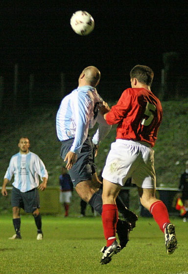 Mark Price and Stuart Hack go for another header
