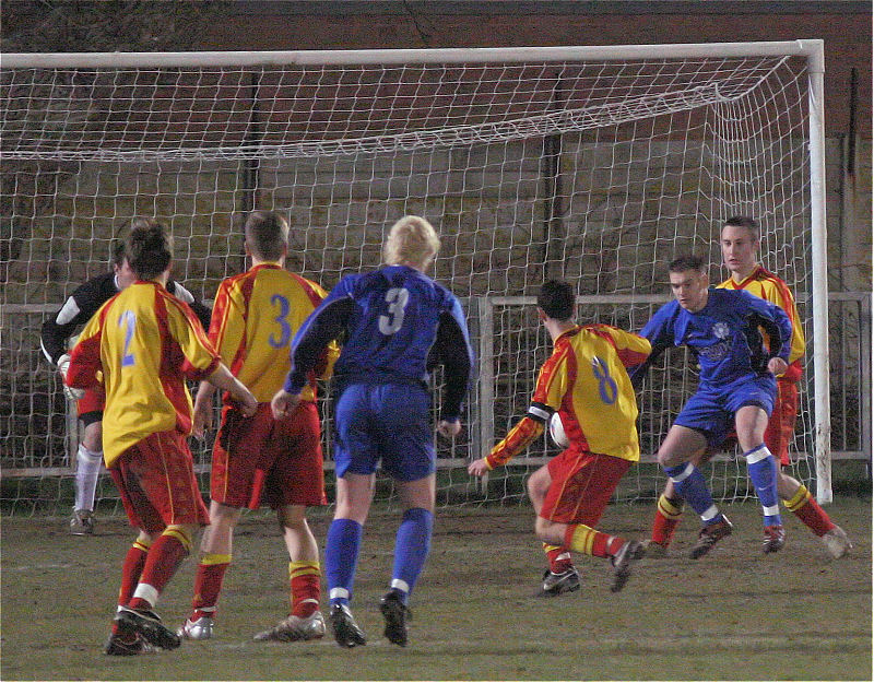 Gary Holmes (8) breaks up another Rustington attack
