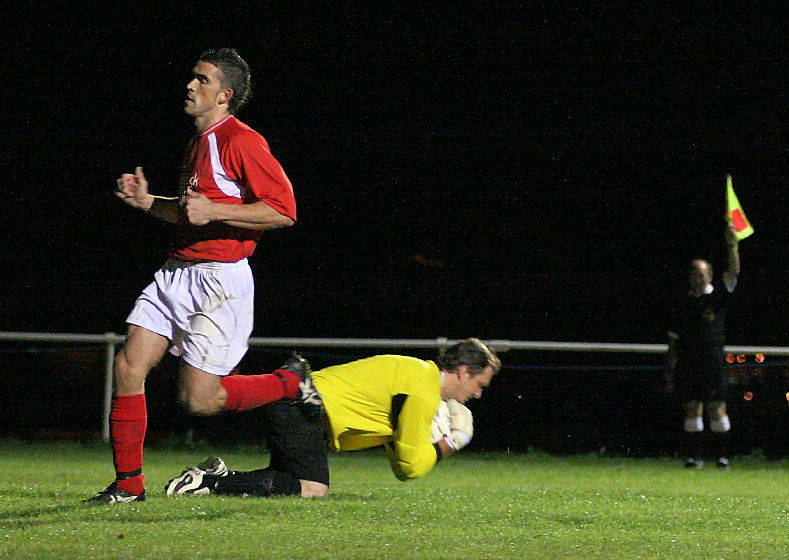 Worthing Utd keeper James Everett gets to the ball before Jason Wimbleton but it's offside anyway
