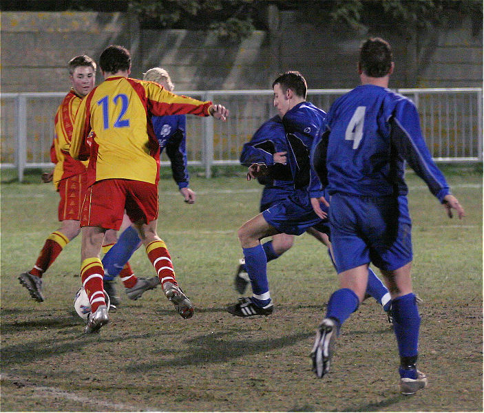 Paul Salvage (12) looks for a way through Rustington's defence
