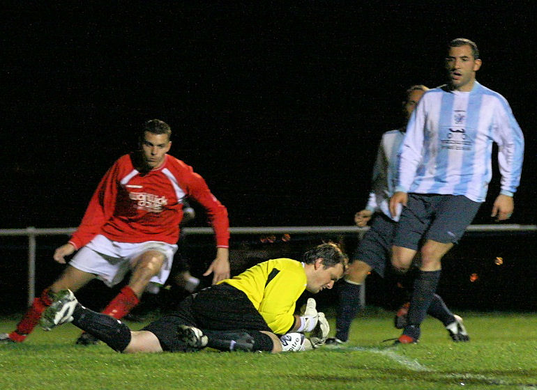 James Everett shields the ball from Jim Smith with Pete Christodoulou backing up
