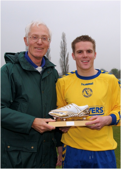 Darren Hickman receives Player of the Year award from Chairman John Hutter
