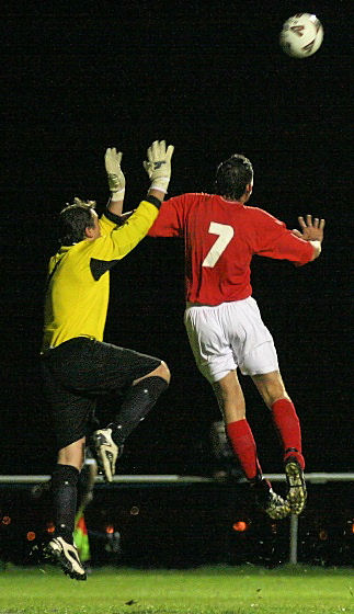 James Everett and Jason Wimbleton go for this high ball
