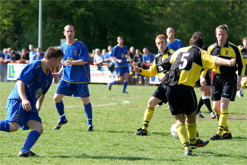 Tom Edmonds (5) clears up for Burgess Hill
