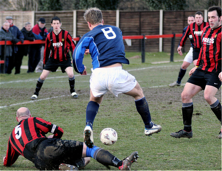 Tony Miles (5) tackles Dean Chamberlain (8)
