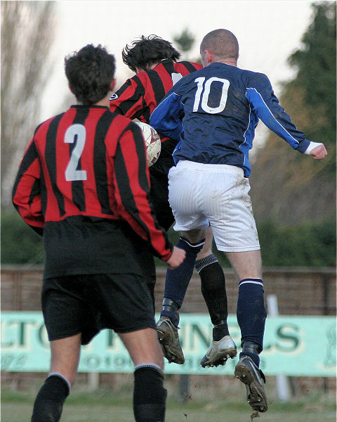 Mark Dixon (2) watches as the ball drops behind Kieron Howard and James Body 
